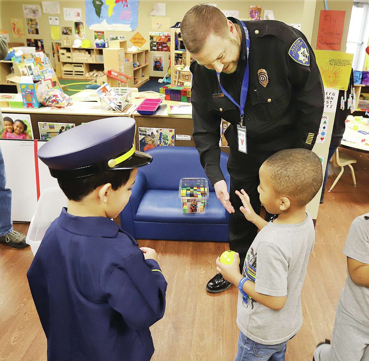 John Badman|The Telegraph Alton Police Lt. Michael O'Neill interacts with students Tuesday at the Riverbend Head Start's Esic Robinson facility in Alton.