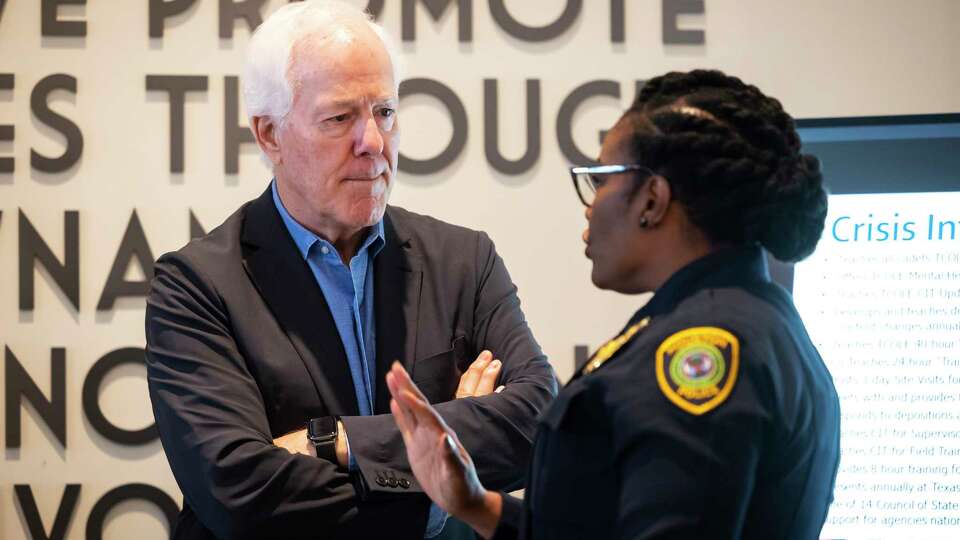 U.S. Senator John Cornyn (R-TX) listens to Assistant Houston Police Chief Chandra Hatcher at Houston City Hall before a press conference on Tuesday, Feb. 21, 2023.