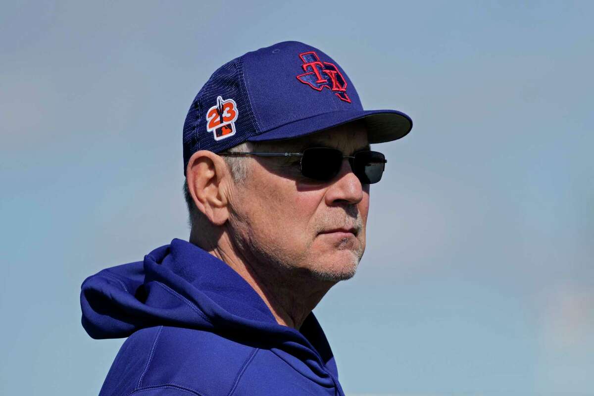Texas Rangers manager Bruce Bochy watches during spring training baseball practice Wednesday, Feb. 15, 2023, in Surprise, Ariz. (AP Photo/Charlie Riedel)