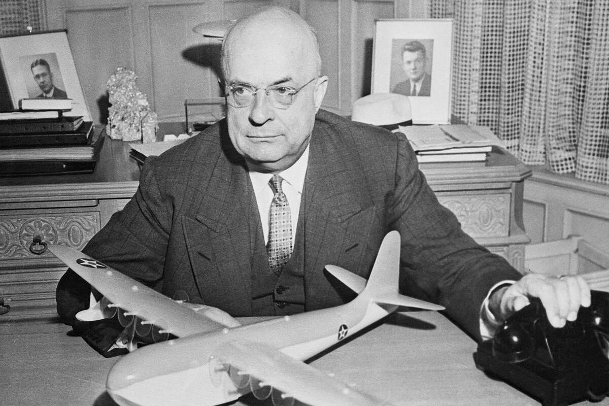 Shipbuilder Henry J. Kaiser holds a model of a seaplane designed by his engineers. Kaiser had the legendary Tahoe property Fleur du Lac built in under a month in 1935.