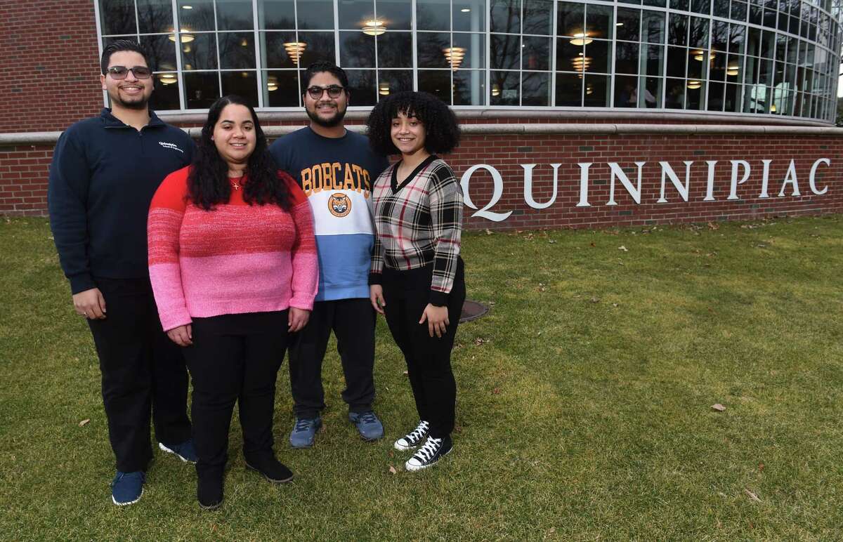 From left, Sebastian Vacco, with his younger triplet siblings, Ashley, Lucas and Jade, photographed at Quinnipiac University in Hamden . The triplets from Nanuet, N.Y., recently transferred to Quinnipiac University.