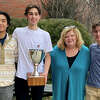 Darien boys squash captains present the FairWest Cup to Principal Ellen Dunn. From left are David Zhao, Will Koons, Principal Dunn, and Andrew Banks.