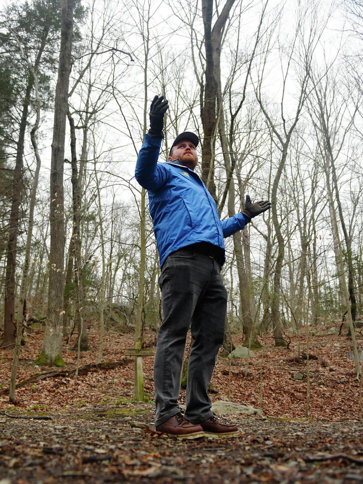 Greenwich Land Trust Director of Land Stewardship Chris Aldrich leads a hike in Mianus River Park on the border of Stamford and Greenwich, Conn. Tuesday, Feb. 21, 2023. The Friends of Mianus River Park and the Greenwich Land Trust led a winter walk to show hikers the natural and historical features of the park.
