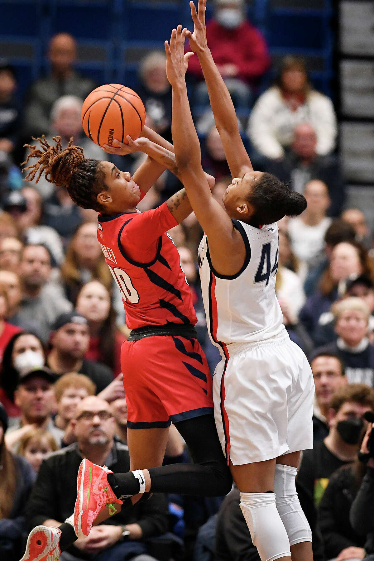 St. John's Kadaja Bailey (30) shoots over UConn's Aubrey Griffin (44) in the first half of an NCAA college basketball game, Tuesday, Feb. 21, 2023, in Hartford, Conn. (AP Photo/Jessica Hill)