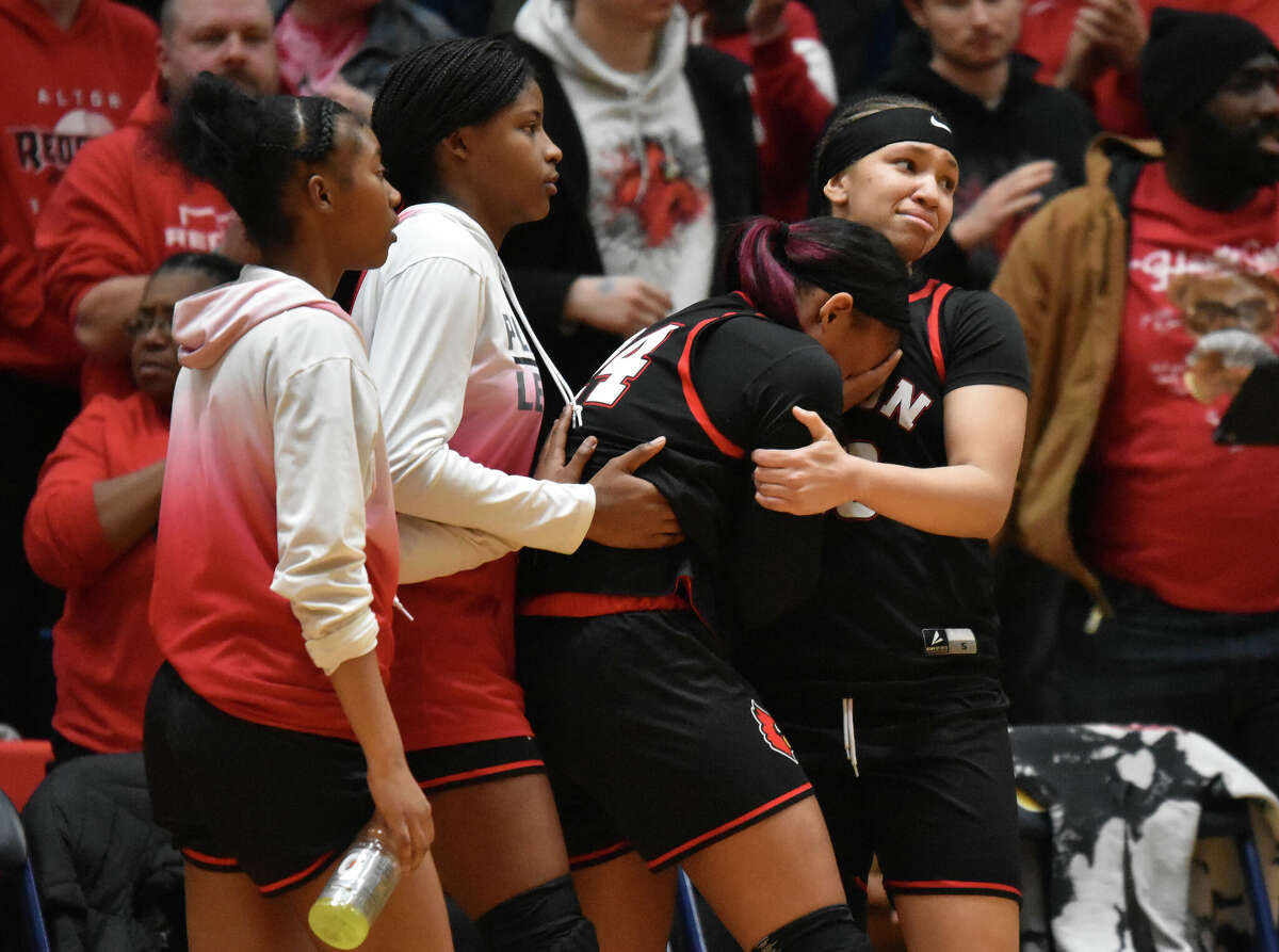 Alton players Alyssa Lewis, left, and Laila Blakenyconsole each other after a loss to O'Fallon in the Class 4A O'Fallon Sectional semifinals on Tuesday at the Panther Dome in O'Fallon.
