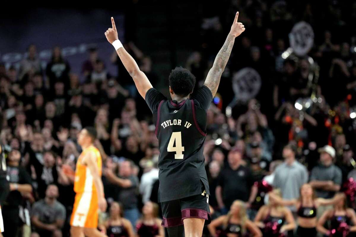 Texas A&M guard Wade Taylor IV (4) reacts after the team's 68-63 win over Tennessee in an NCAA college basketball game Tuesday, Feb. 21, 2023, in College Station, Texas. (AP Photo/Sam Craft)
