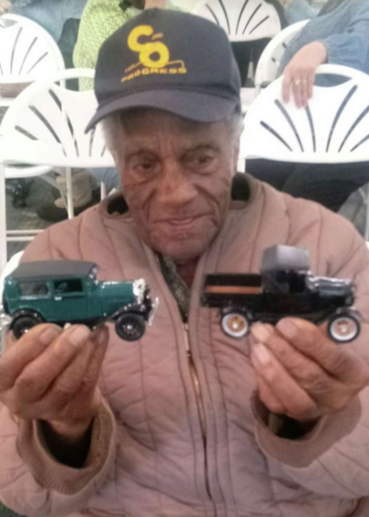 Clarence Vicent, soon to be 98, loves history. He is pictured with antique toy cars at a Lake County Historical Society program.