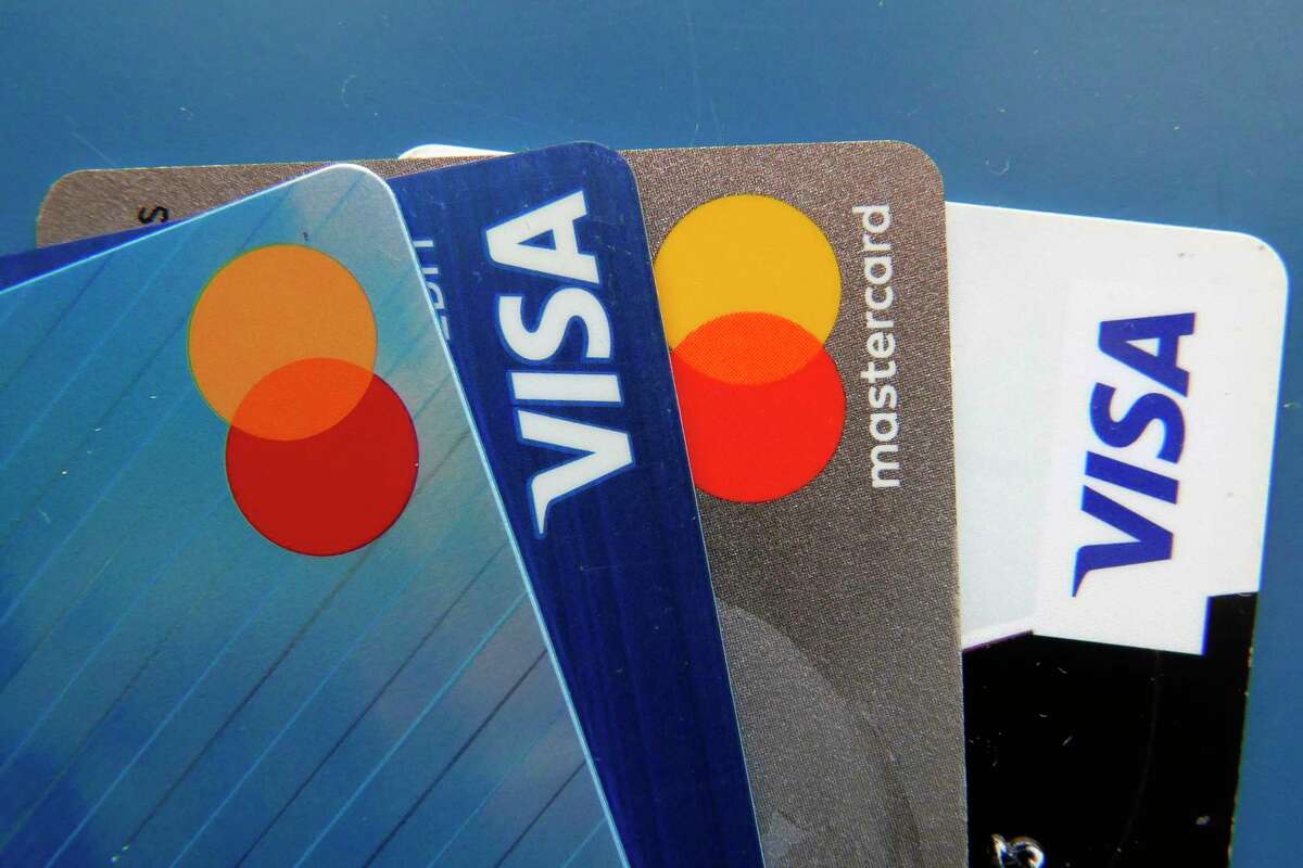 File - Credit cards as seen July 1, 2021, in Orlando, Fla. A low credit score can hurt your ability to take out a loan, secure a good interest rate, or increase a credit card spending limit.
