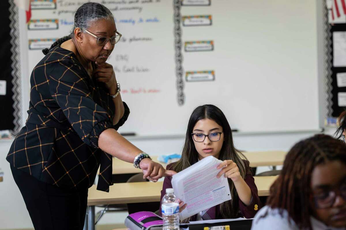 Educator Nelva Williamson instructs Naylie Leal during her AP African American studies course at the Young Women’s College Preparatory in downtown Houston on Tuesday, Feb. 21, 2023.