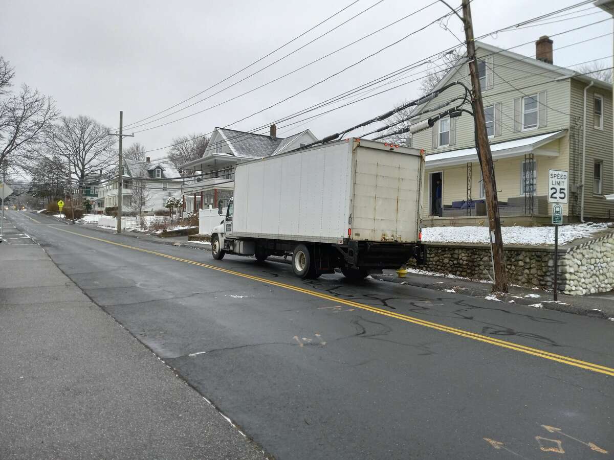 A truck is parked in front of a house on New Litchfield Street, Torrington. 