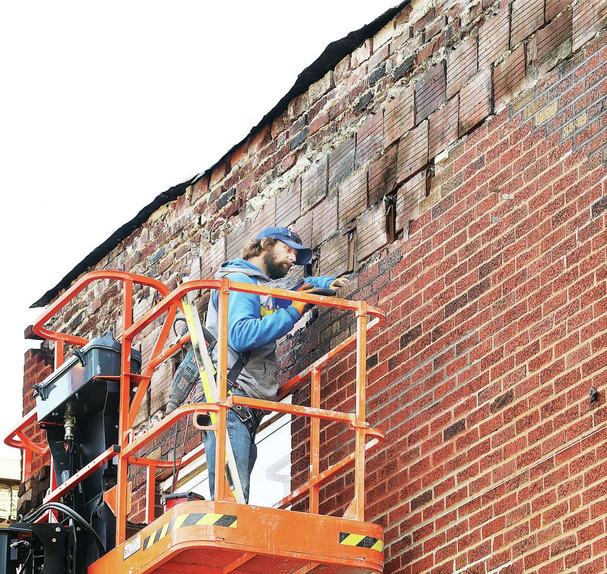 Workers in downtown Wood River this week were carefully replacing the loose bricks they removed from the front of the building that houses Cleary's Shoes & Boots, 48 E. Ferguson Ave. in Wood River. Workers have done similar work to other nearby downtown buildings where the bricks were almost falling off. The work should keep the old storefront secure for decades to come.