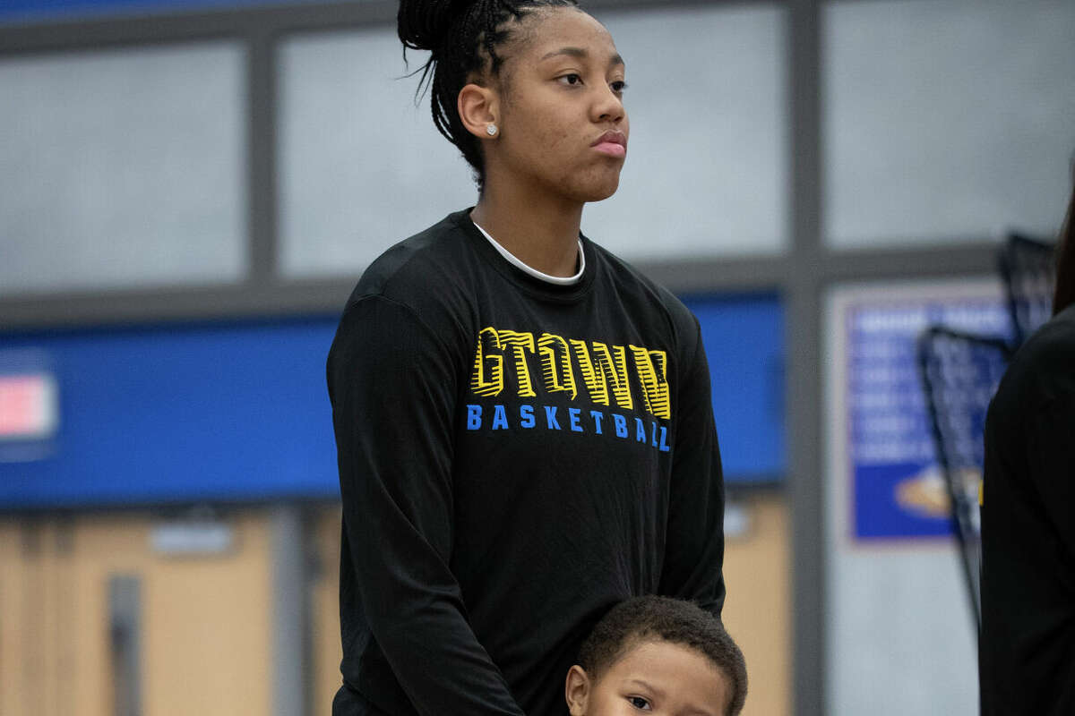UConn recruit KK Arnold stands with her nephew Kendrick Arnold before her team's Senior Night game at Germantown High School in Germantown, Wisconsin Tuesday, Feb. 14, 2023.