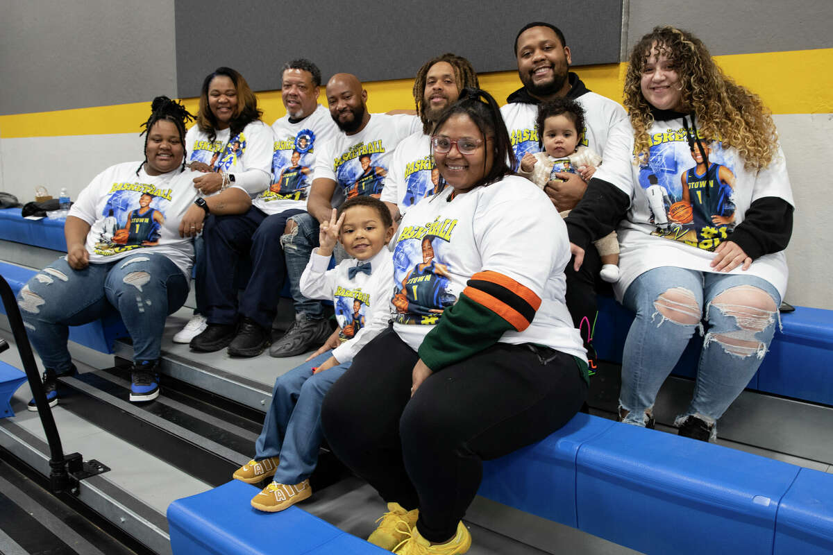 The family of UConn recruit KK Arnold sits in the crowd ahead of her Senior Night game at Germantown High School in Germantown, Wisconsin Tuesday, Feb. 14, 2023.