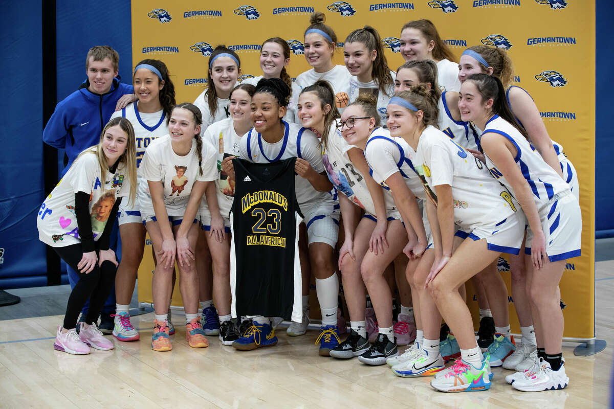 KK Arnold poses with her team ahead of their game at Germantown High School in Germantown, Wisconsin Tuesday, Feb. 14, 2023.