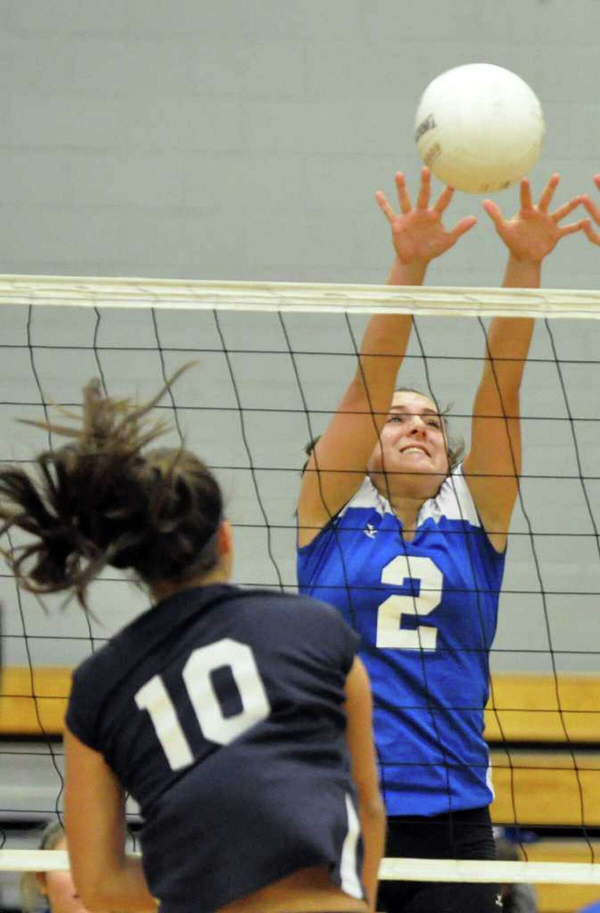 Fairfield Ludlowe's Brandi Segala blocks a shot by Staples' Alex Masiello during the girls volleyball game at Ludlowe on Wednesday, Oct. 13, 2010.