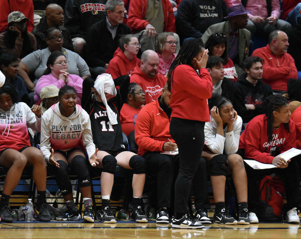 Alton's bench reacts to a call late in the second half against O'Fallon during the O'Fallon Class 4A Sectional semifinals on Tuesday inside the Panther Dome in O'Fallon.