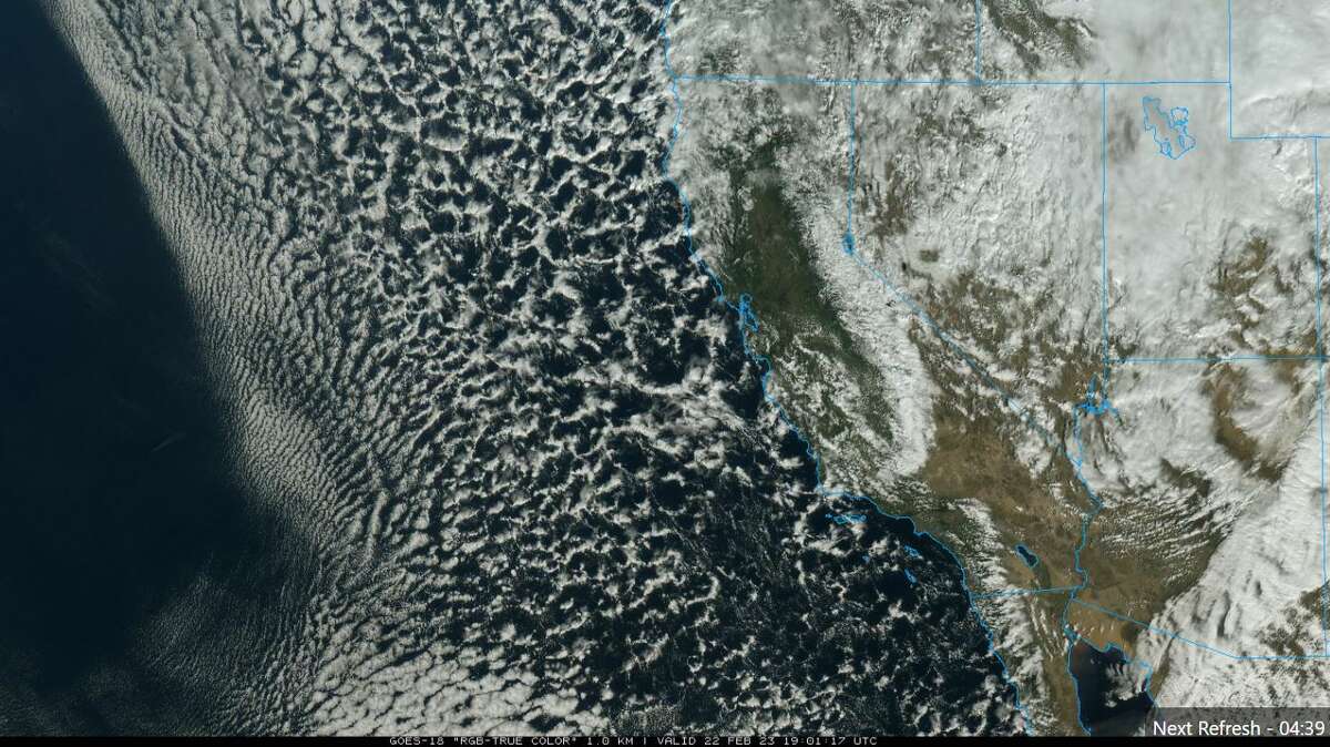 This GOES-WEST satellite image shows the rain and snow bands lining up along the coast of California, with the Sierra Nevada snowpack already glistening farther inland.