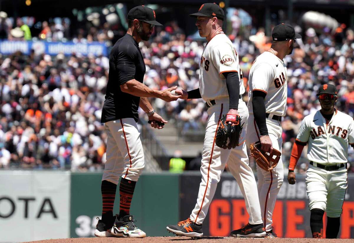 Anthony DeSclafani of the San Francisco Giants is taken out of the