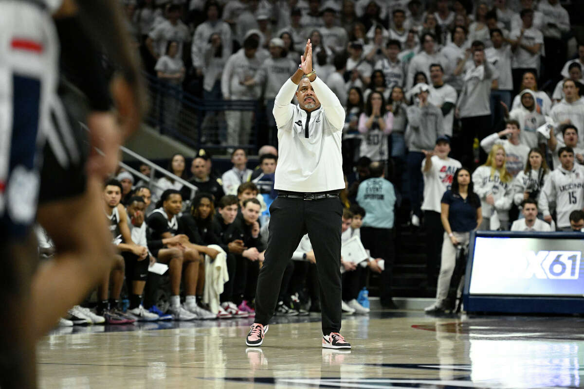 Providence coach Ed Cooley gestures to the team while standin on the court during the first half of an NCAA college basketball game against UConn, Wednesday, Feb. 22, 2023, in Storrs, Conn. (AP Photo/Jessica Hill)