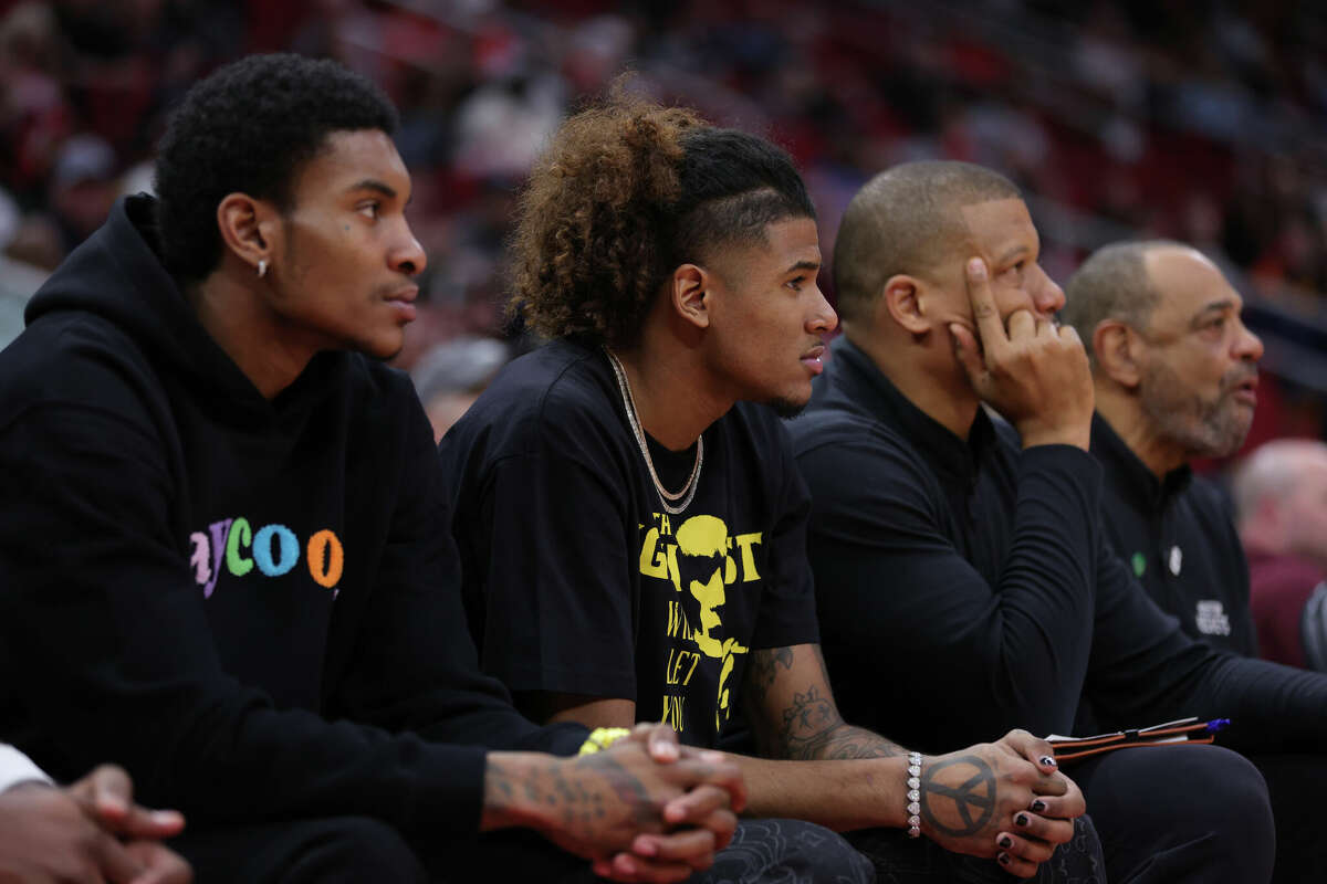 Jalen Green #4 and Kevin Porter Jr. #3 of the Houston Rockets sit on the bench against the Oklahoma City Thunder during the first half at Toyota Center on February 01, 2023 in Houston, Texas.