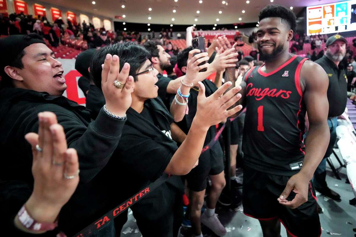 Jamal Shead and UH celebrated with fans after clinching a share of the AAC title at home Wednesday. They can win the league outright with a win Saturday at East Carolina.