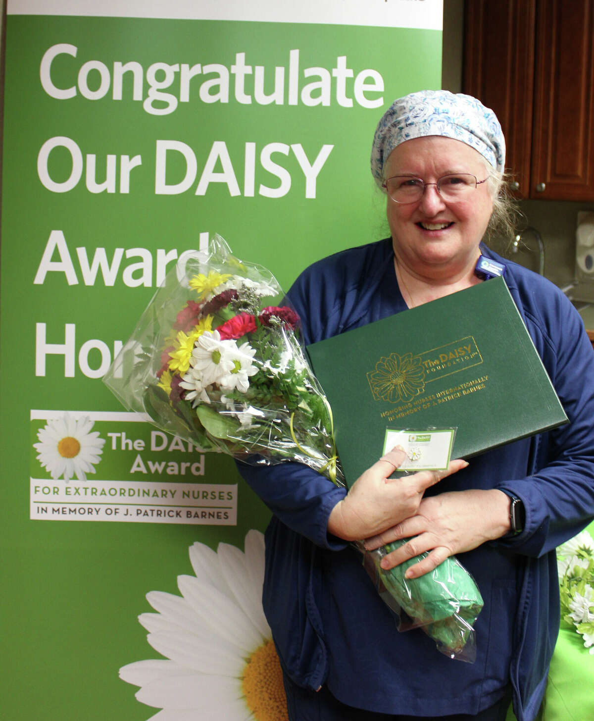 Micki Doherty, RN, who works in the Reed City Hospital inpatient department, was honored with a DAISY Award after being nominated by a recent patient. 