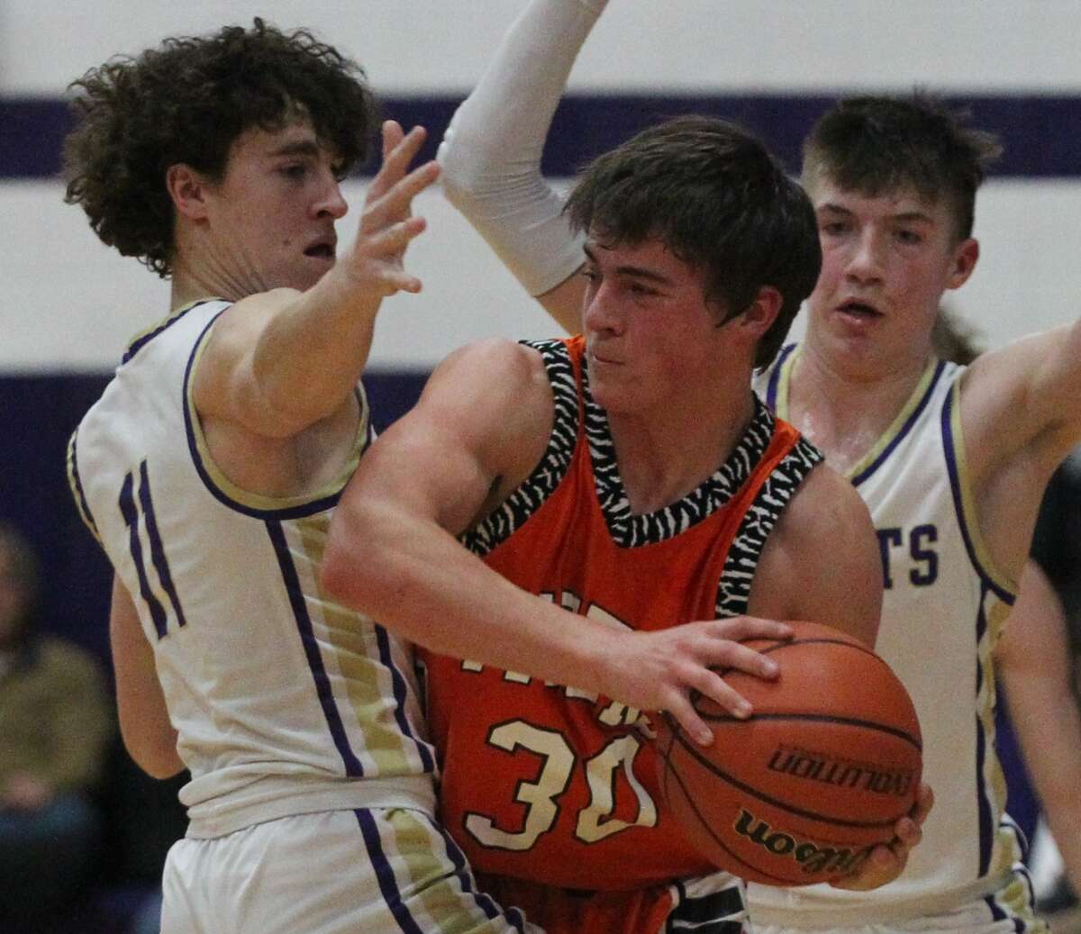 Routt's Nolan Turner (left) and Bryson Mossman trap Greenfield-Northwestern's Talon Albrecht during a boys' basketball game at the Routt Dome in Jacksonville Wednesday night.