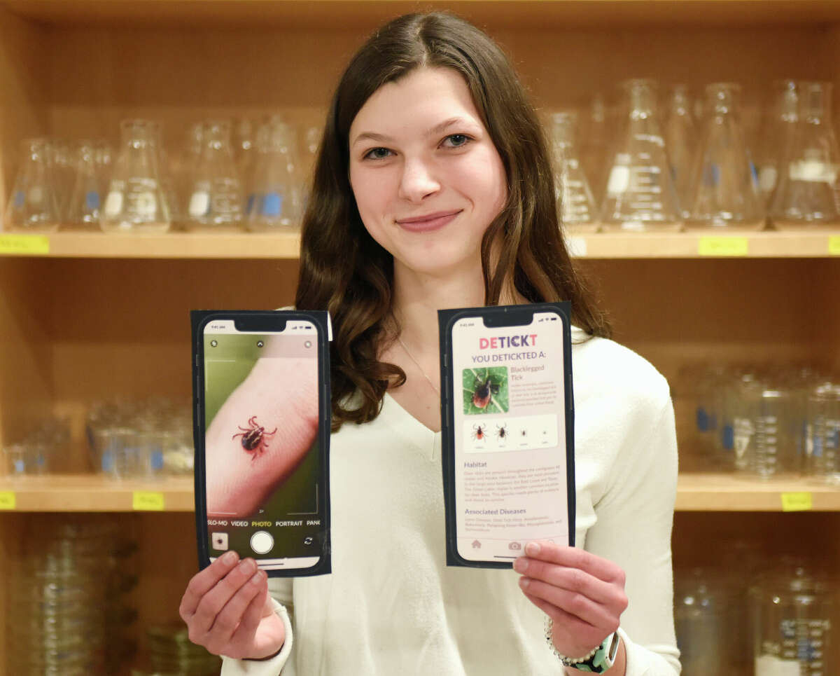 King School junior Antonia Kolb, of New Canaan, shows screenshots from her new app DETICKT IT at King School in Stamford, Conn. Thursday, Feb. 23, 2023. DETICKT IT allows users to take a photo of a tick and identify the particular species of tick and the potential risk of tick-borne diseases.