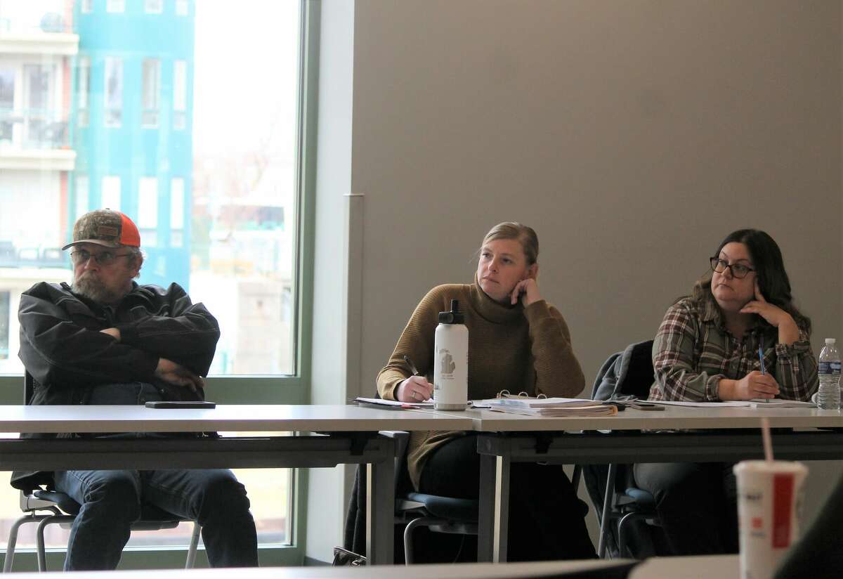 Kevin Helminak (left), City of Manistee Housing Commission maintenance crew leader; Lindsay McIntyre, acting executive director; and Cindy Scott, financial analyst take part in a housing commission meeting Feb. 21 at the West Shore Community College Manistee Downtown Education Center.