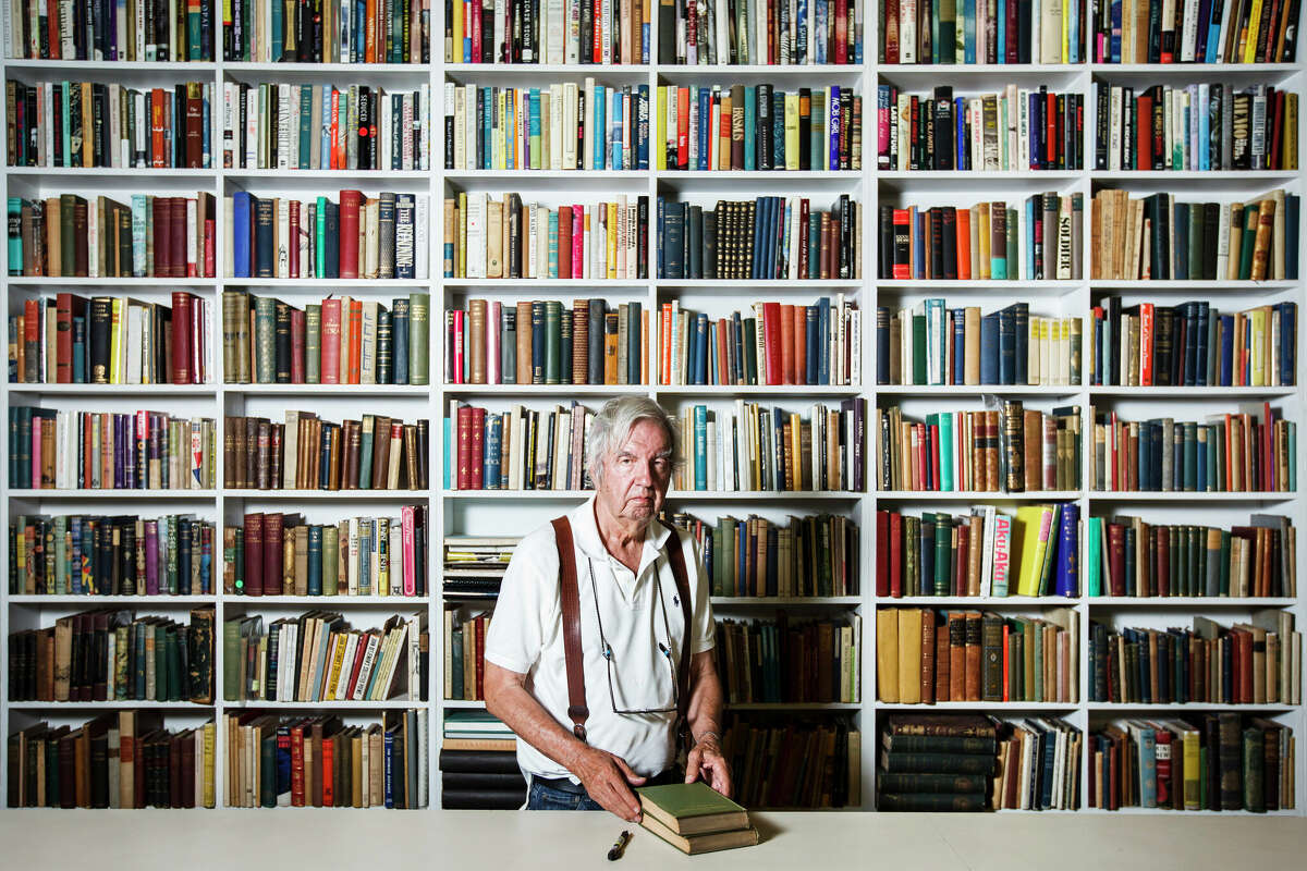 Larry McMurtry, the famed Texas novelist, screenwriter and bookseller, stands in his bookstore, Booked Up, in Archer City in 2012. ( Michael Paulsen / Houston Chronicle )