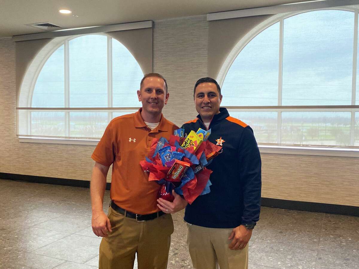 Alvin Junior High Principal Robert Ford, left, was named Alvin ISD's secondary principal of the year. With him is the district's assistant superintendent of secondary education, Bobby Martinez.