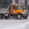 A city of Midland plow clears snow on Feb. 22, 2023 on Buttles Street.