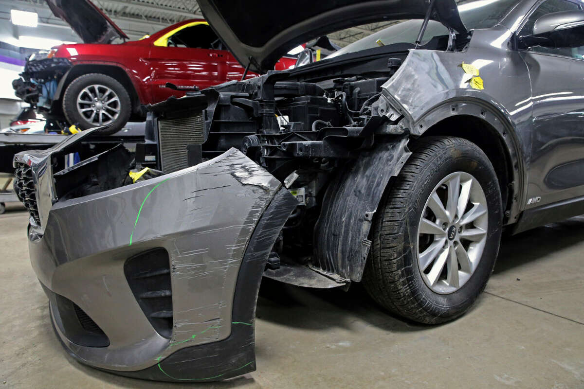 A Kia which was damaged after being stolen is seen at an auto repair shop in Milwaukee on Wednesday, Jan. 27, 2021. Automakers Hyundai and Kia are offering software updates for millions of their vehicles that are missing a “key” anti-theft device, an issue that was exploited on social media and led to rampant theft of the cars. The National Highway Traffic Safety Administration said Tuesday, Feb. 14, 2023 that the software updates the theft alarm software logic to extend the length of the alarm sound from 30 seconds to one minute and requires the key to be in the ignition switch to turn the vehicle on.