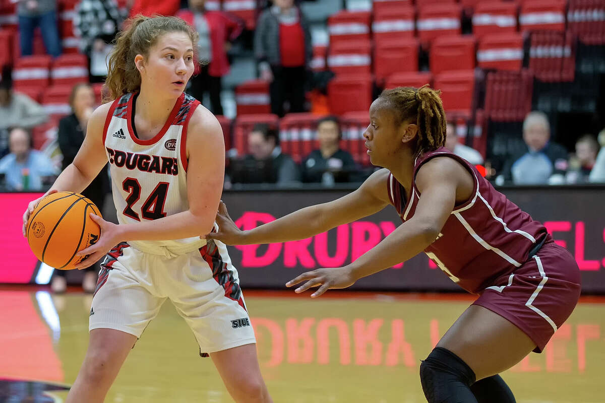 SIUE's Sofie Lowis, left, is guarded by Little Rock's Jayla Brooks during Thursday night's game in Edwardsville.