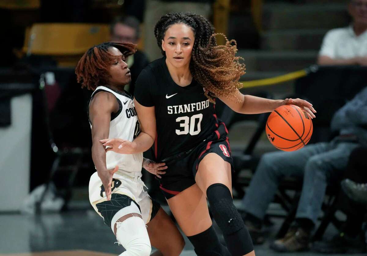Stanford guard Haley Jones, right, drives past Colorado guard Jaylyn Sherrod during the second half of an NCAA college basketball game Thursday, Feb. 23, 2023, in Boulder, Colo.