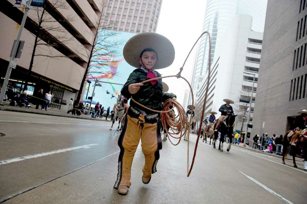 Scenes from the Houston Livestock Show and Rodeo parade as the parade returns after skipping a year due to COVID-19 pandemic Saturday, Feb. 26, 2022, in downtown Houston.
