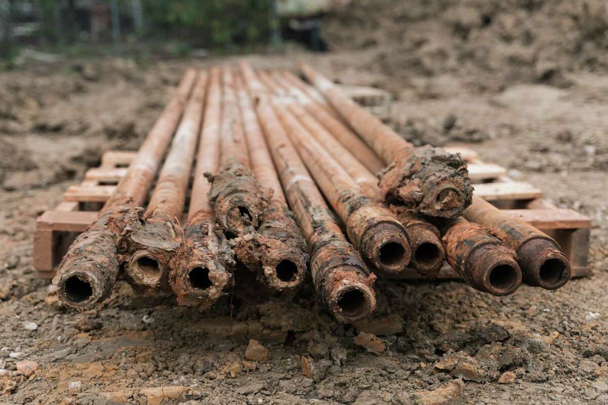 Pipes used to drill underground to install the geothermal system of a co-housing community in Houston, Texas on Friday, Feb. 24, 2023.