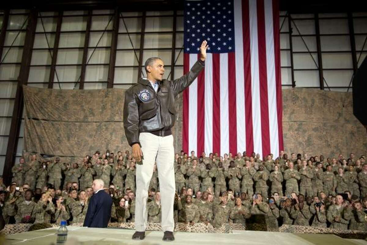 President Barack Obama waves at the conclusion of his remarks to U.S. troops at Bagram Airfield in Bagram, Afghanistan, in 2014. Despite optimistic rhetoric, the war continued for years.