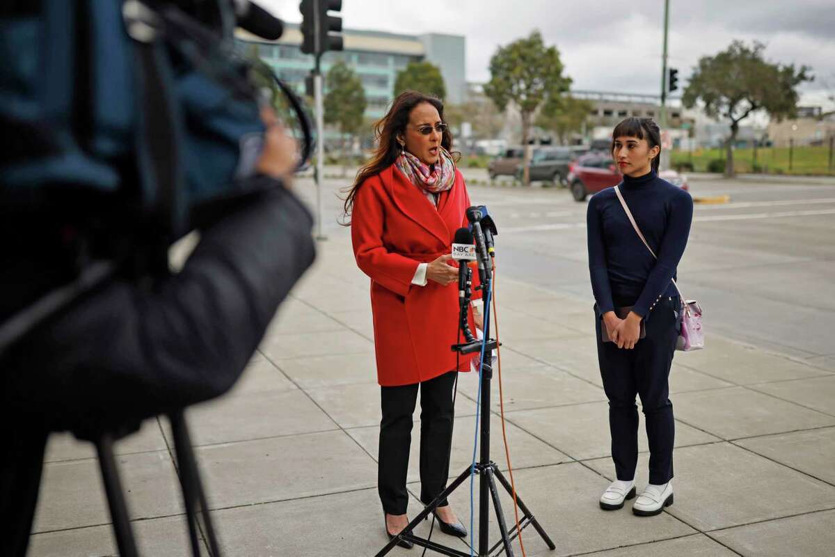 Harmeet Dhillon of the Center for American Liberty, left, and Chloe Cole during a news conference outside Kaiser Permanente in Oakland Thursday. 