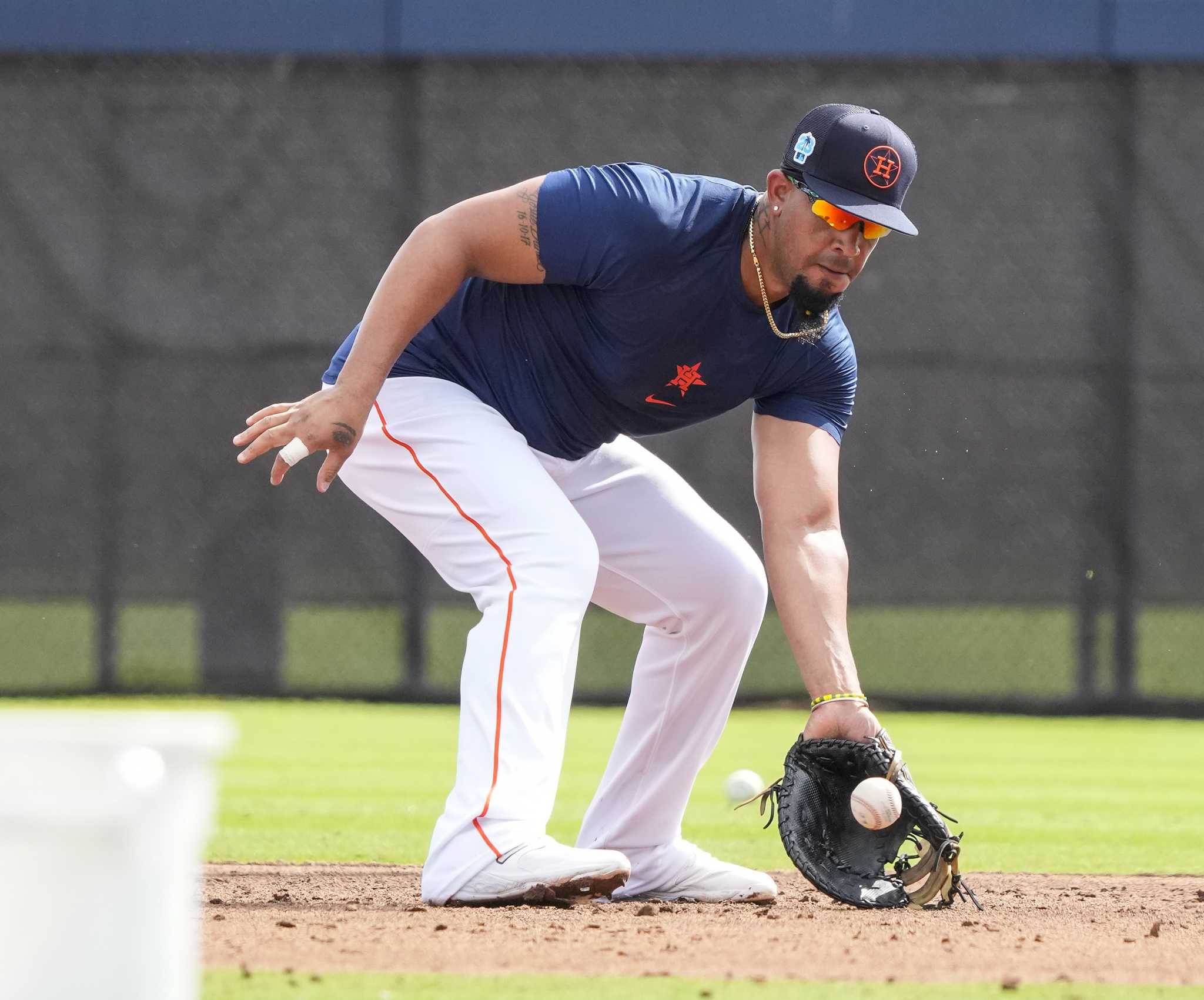 Houston Astros first baseman Jose Abreu works during a spring