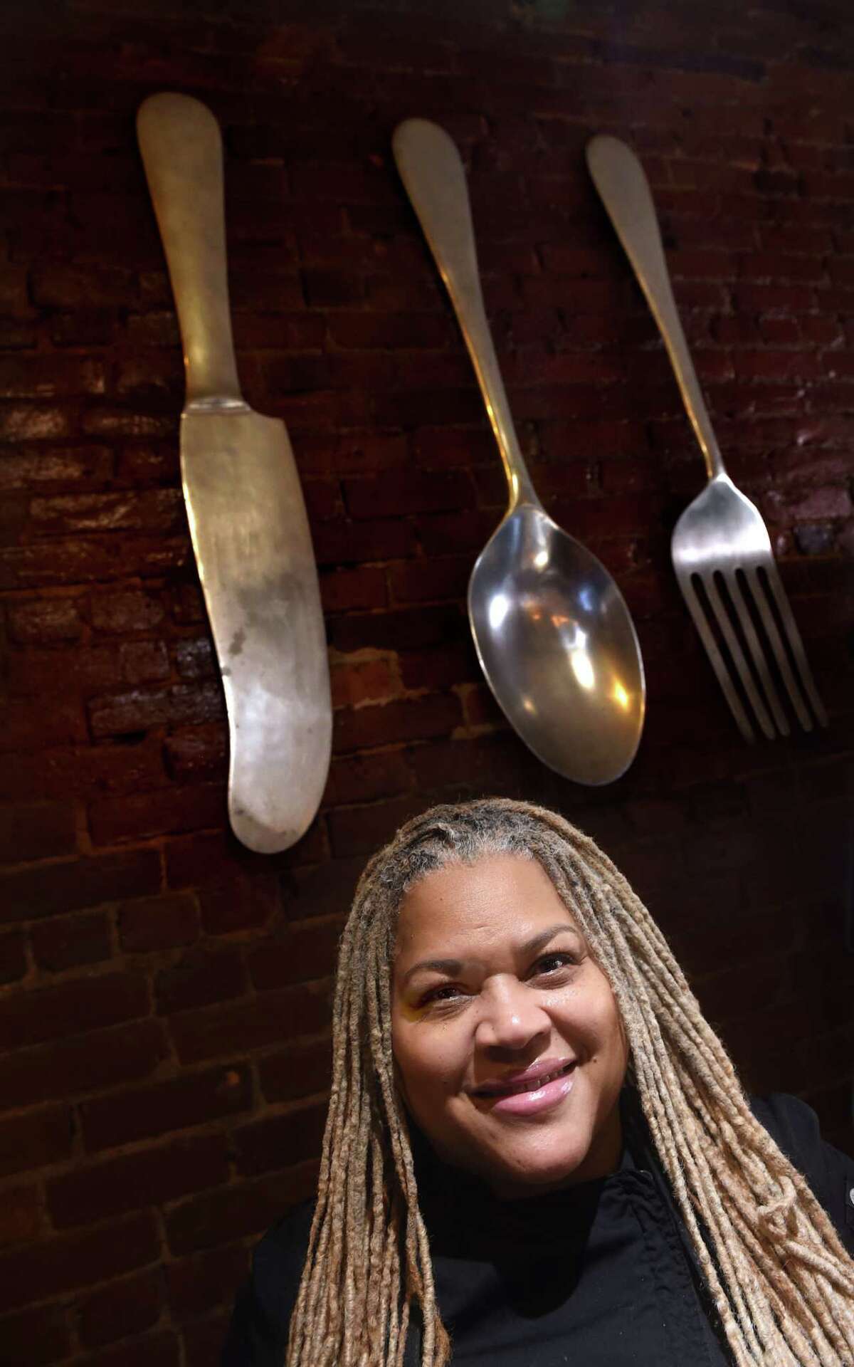 Sandra Pittman, owner of Sandra's Next Generation, is photographed at her restaurant on Congress Avenue in New Haven.