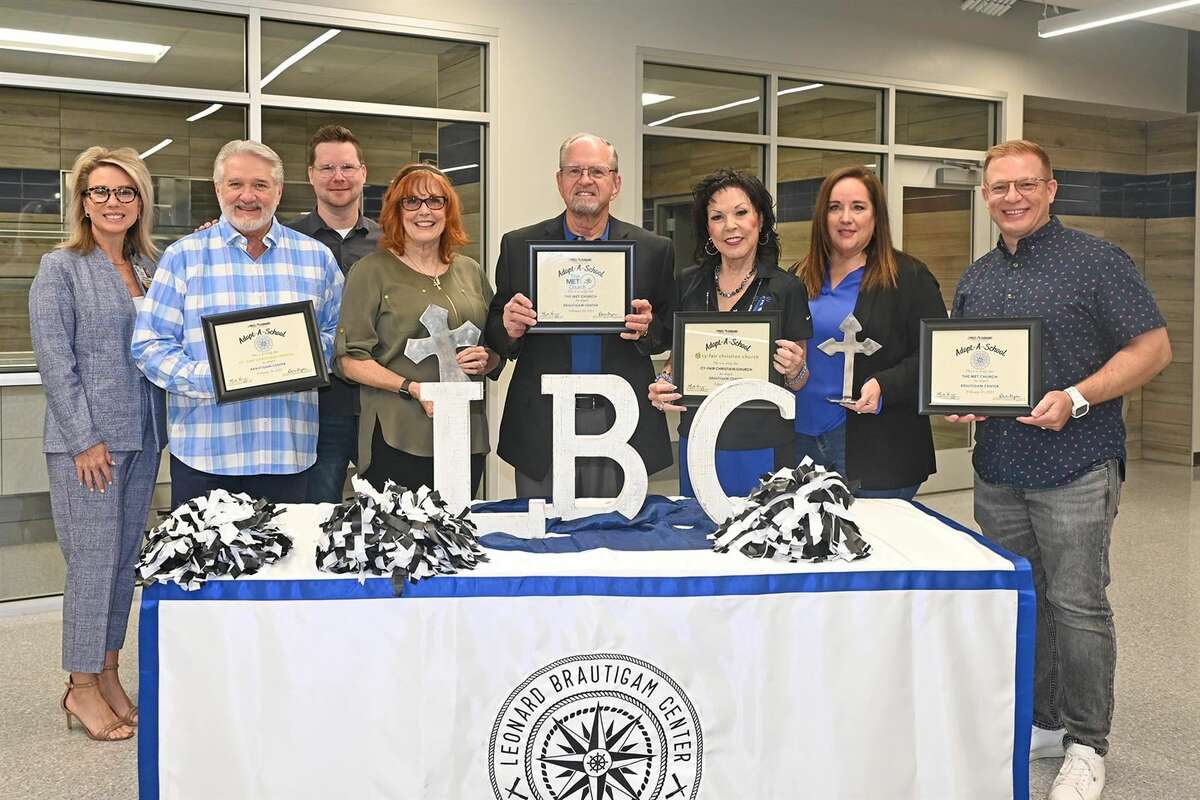 Brautigam Center Principal Martha Strother, third from right, and campus namesake Leonard Brautigam, fourth from right, hold commemorative Adopt-a-School certificates after the school formally entered an adoption partnership with The Met Church’s The HUB and Cy-Fair Christian Church on Feb. 20. They were joined by CFISD Director of Community Engagement Dawn Tryon, left, and representatives from both faith-based organizations.