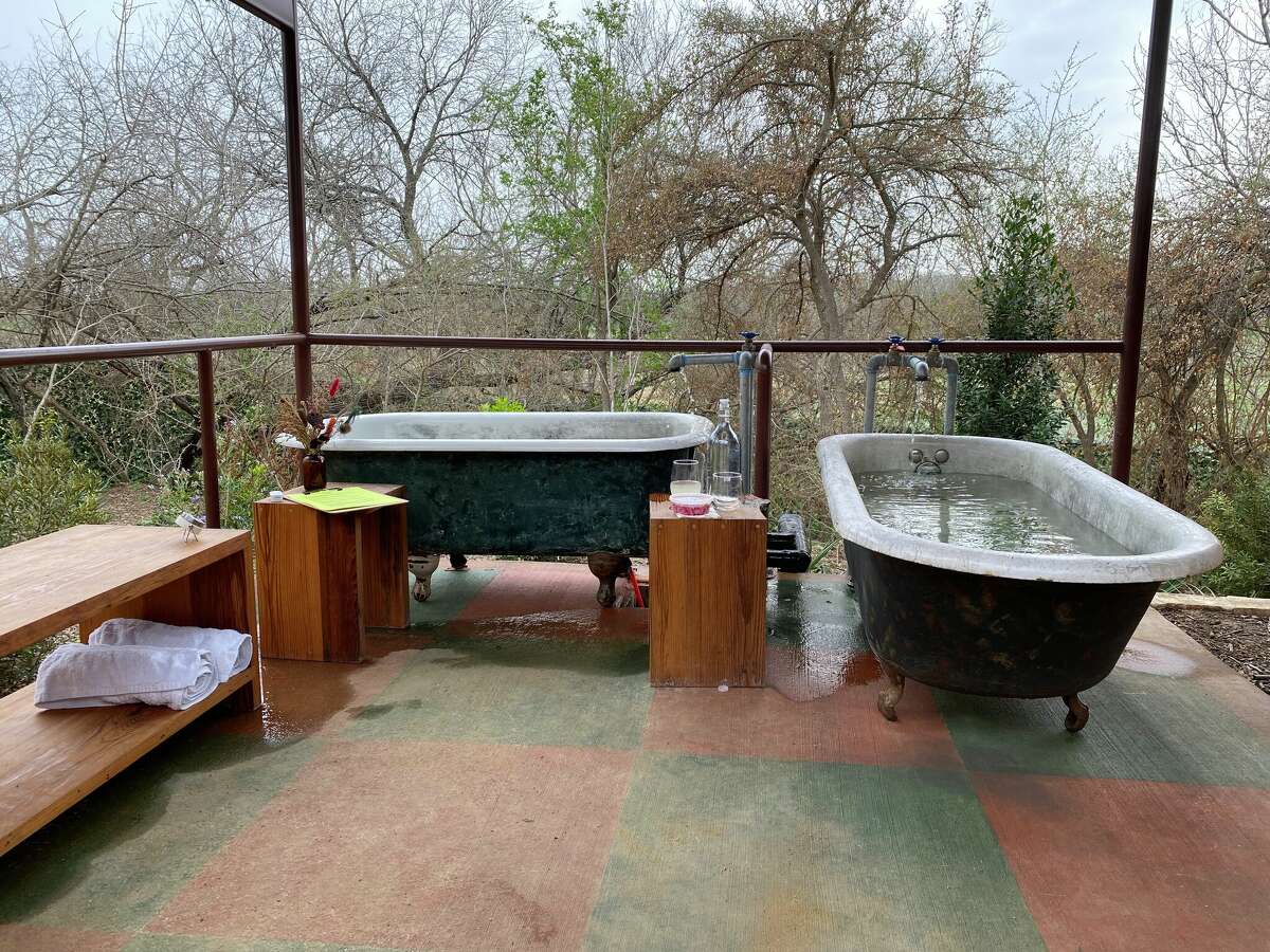 The private claw tub soaking suite at Camp Hot Wells-Bath House & Bar.