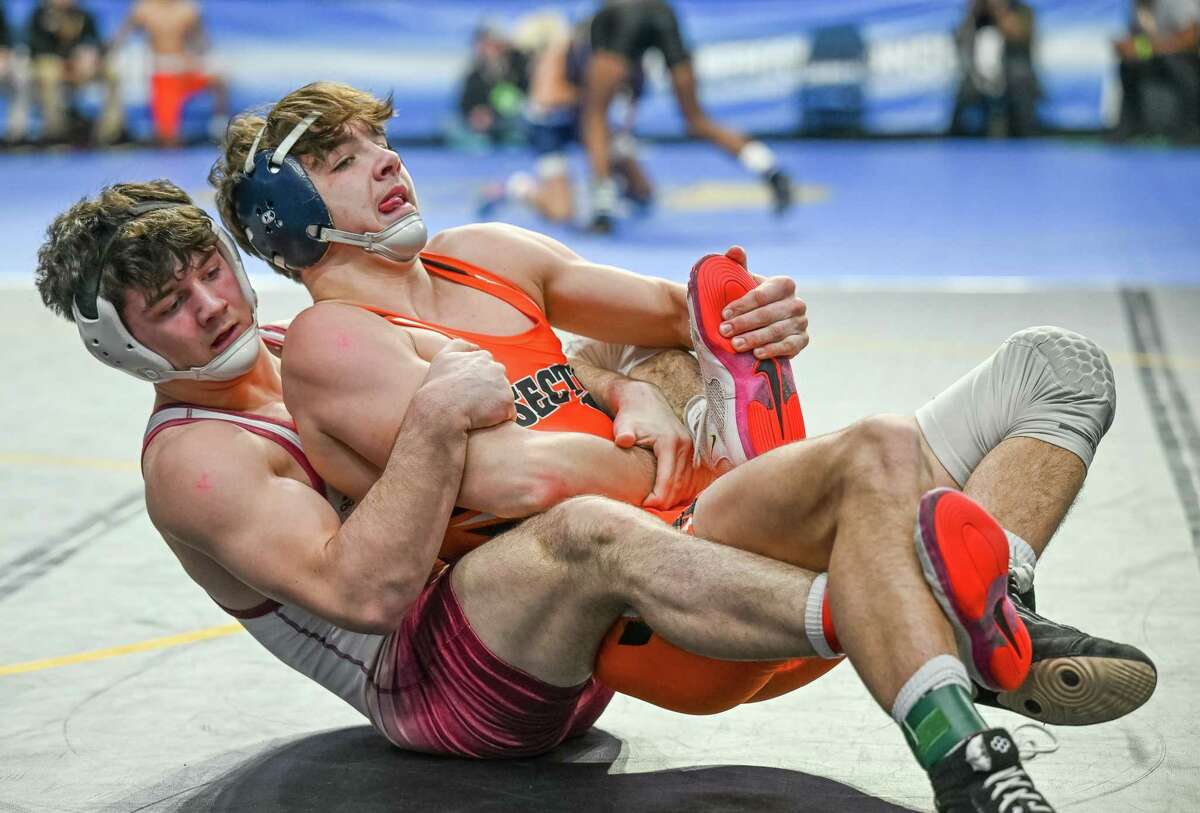 Owen Hicks, left, of Fonda/Johnstown, wrestles against Austin Chase, of Falconer/Cassadaga Valley, during the 145-pound class of the state championships on Friday, Feb. 24, 2023, at the MVP Arena in Albany, NY.