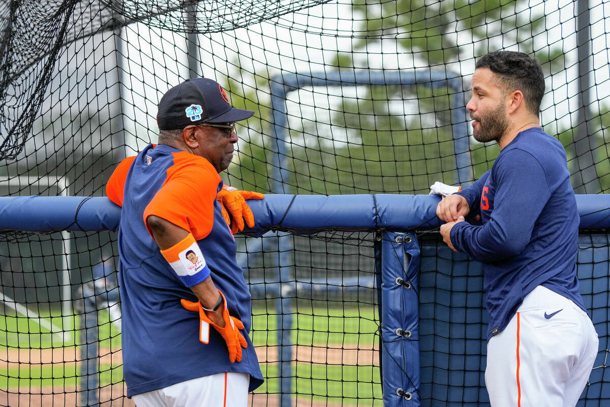Houston Astros manager Dusty Baker Jr. chats with second baseman Jose Altuve during workouts at the Astros spring training complex at The Ballpark of the Palm Beaches on Sunday, Feb. 19, 2023 in West Palm Beach, Florida.