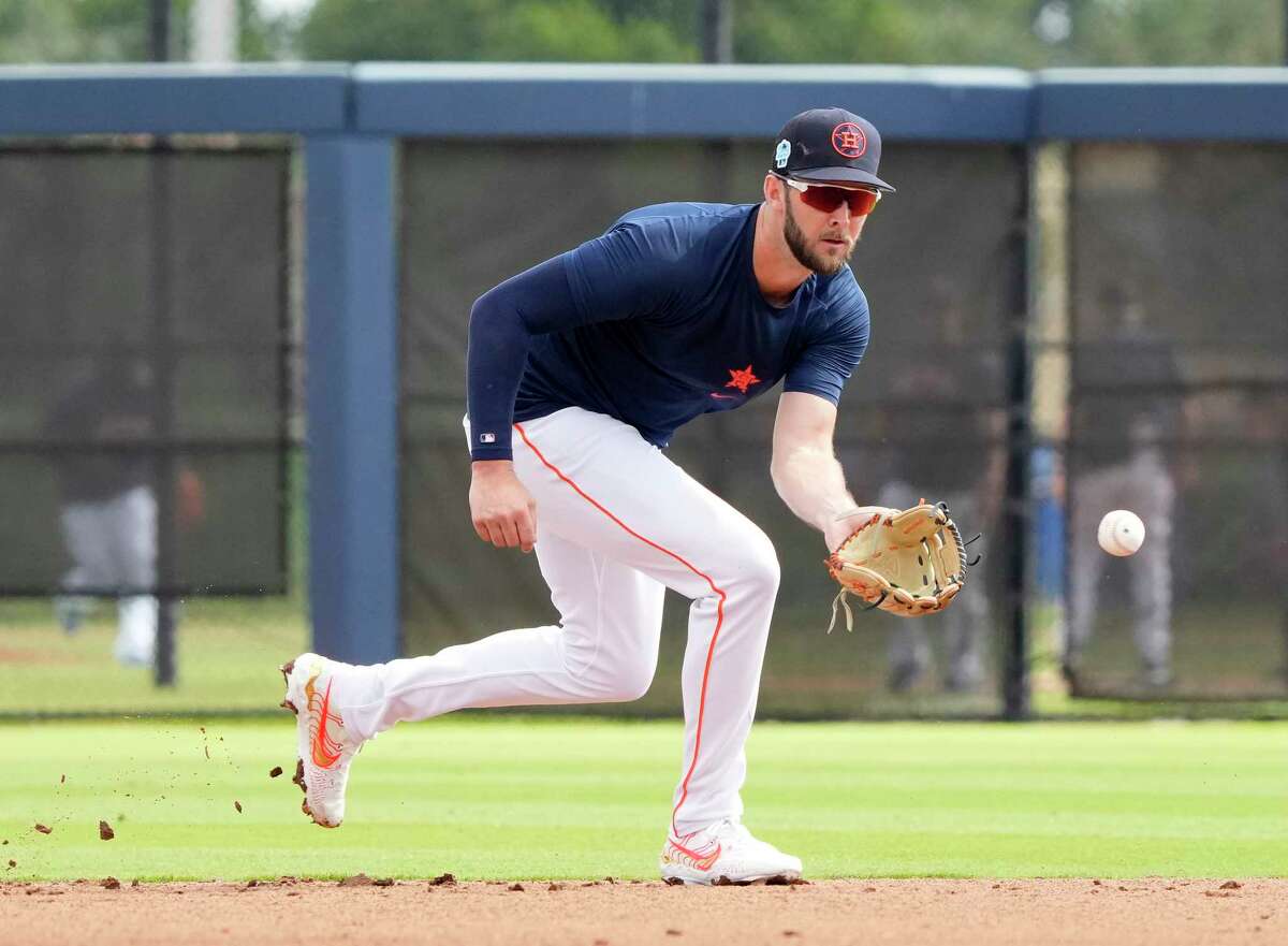 David Hensley takes infield during a recent Astros workout at Ballpark of the Palm Beaches. Hensley made at least 20 starts in the minors last season at second, short and third, plus an additional 15 at first base.