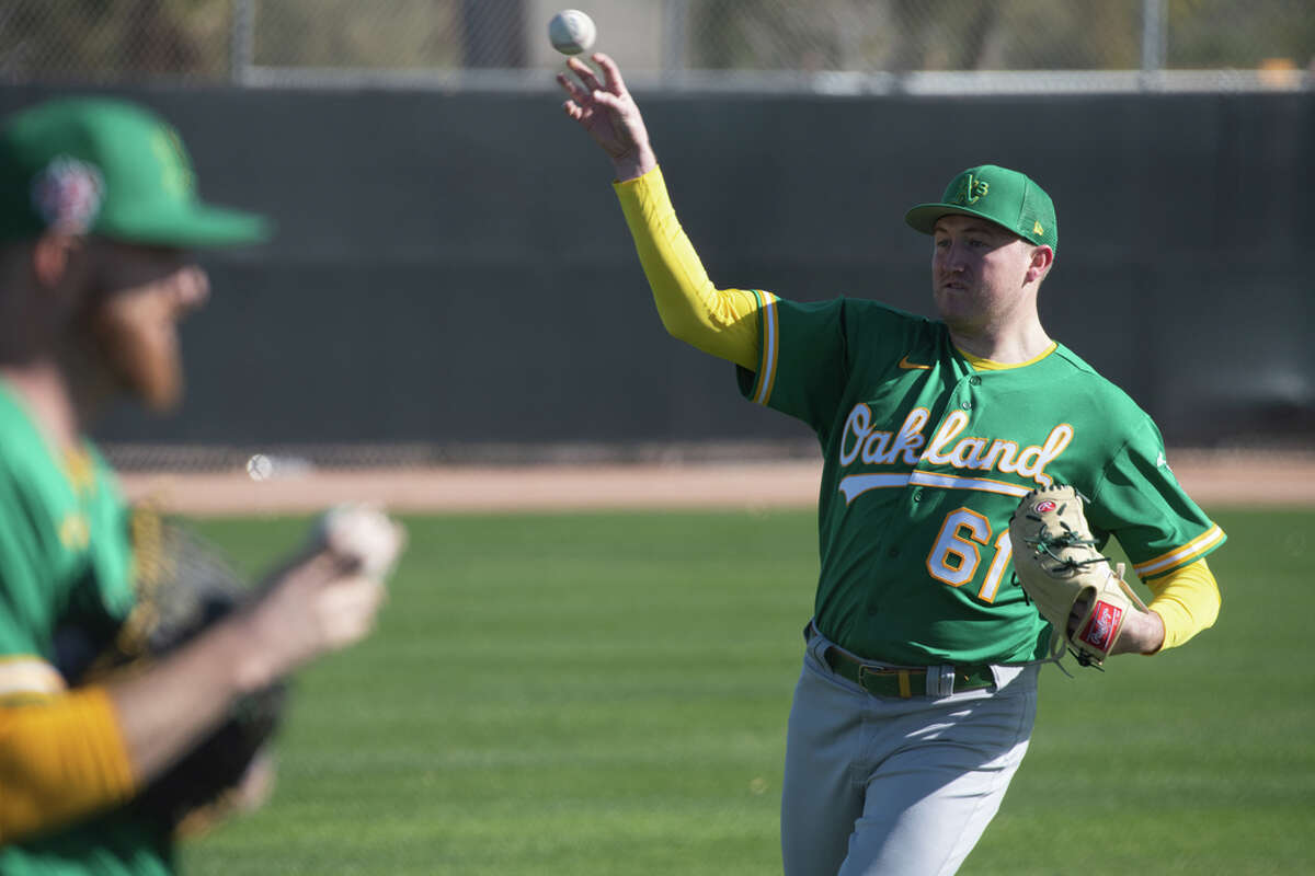 Zach Jackson warms up during a pitchers and catchers practice last week at Hohokam Park in Mesa, Ariz.