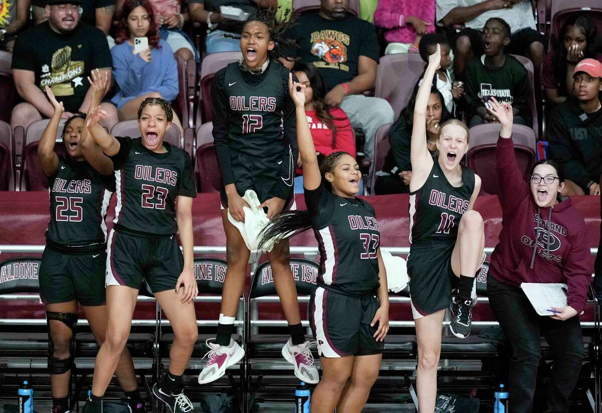 The Pearland beach celebrates a 3-point basket during the second half of a Region III-6A semifinal high school basketball playoff game against Katy, Friday, Feb. 24, 2023, in Houston.