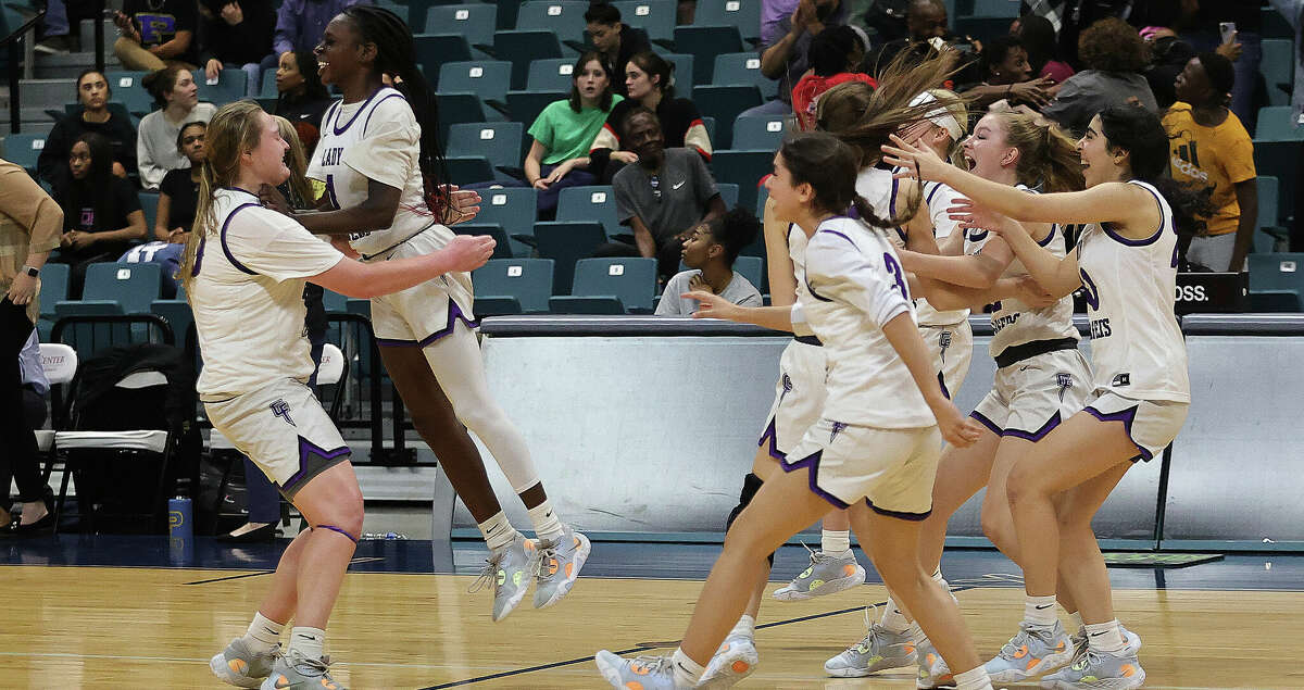 KATY, TX -FEBRUARY 24: Fulshear Chargers celebrate their win over Pflugerville Panthers during a Region III-5A semifinal basketball game at the Merrell Center February 24, 2023 in Katy, Texas.
