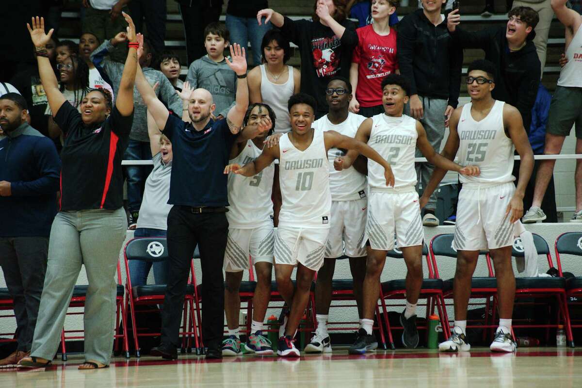 Dawson players coaches and fans react as the Eagles defeat Atascocita in the region III 6A playoff game Friday, Feb. 24, 2023 at Pasadena ISD Phillips Field House.